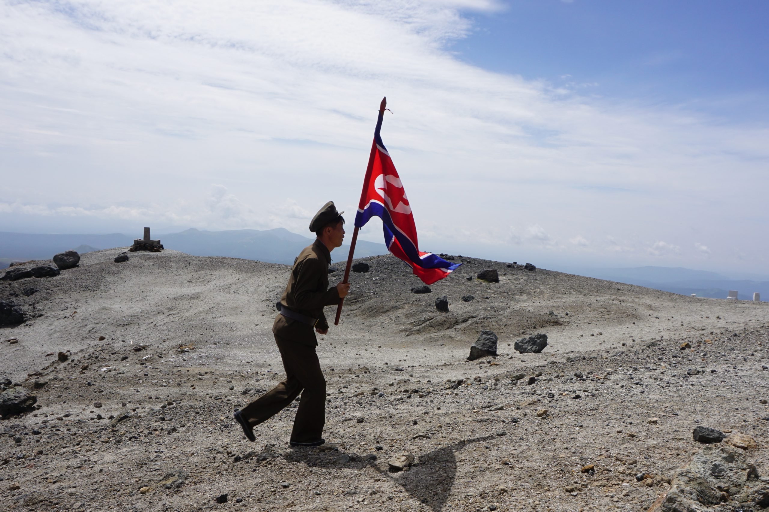 A soldier carrying a flag on Mt. Paektu, North Korea