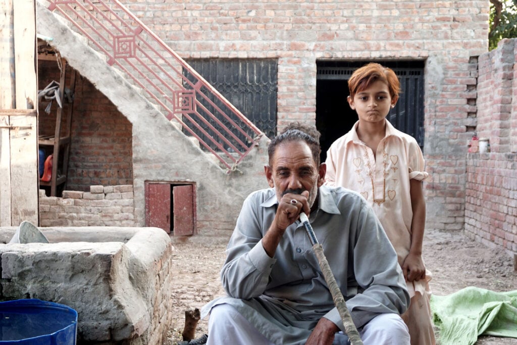 Farmer and grandson in Burj Attari, Pakistan