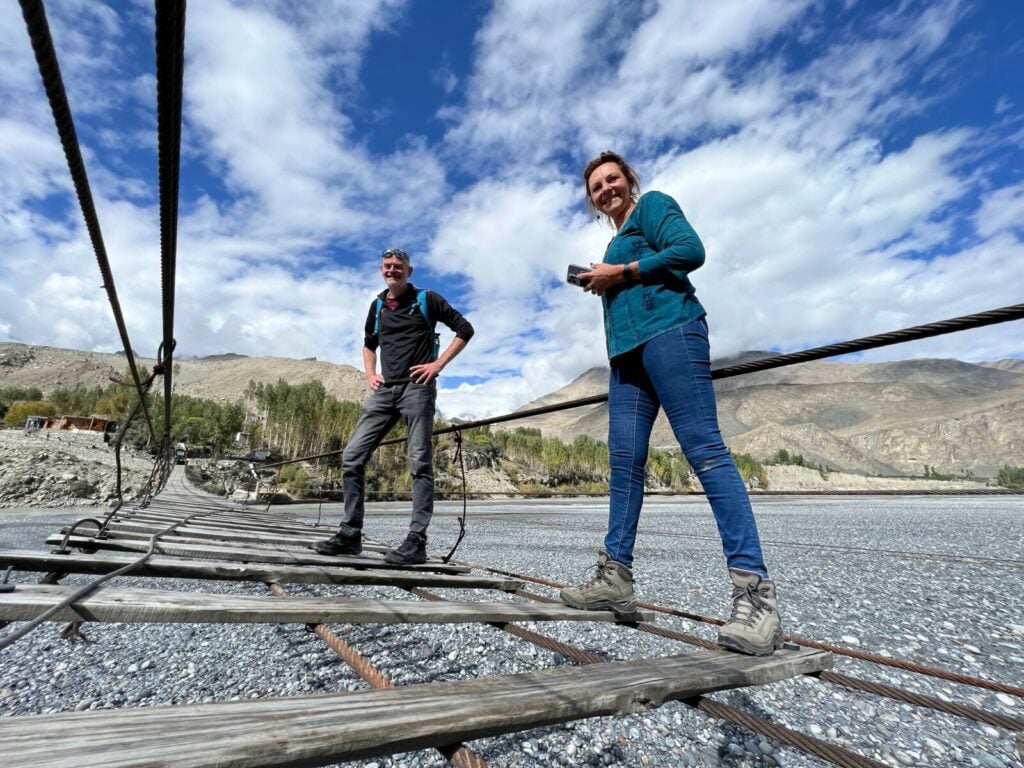 Two visitors on the Hussaini Bridge in Passu Pakistan