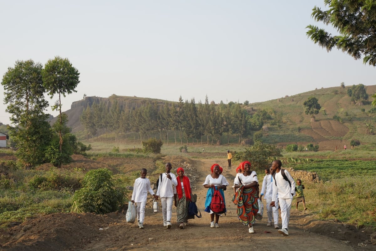 DRC locals walking through fields